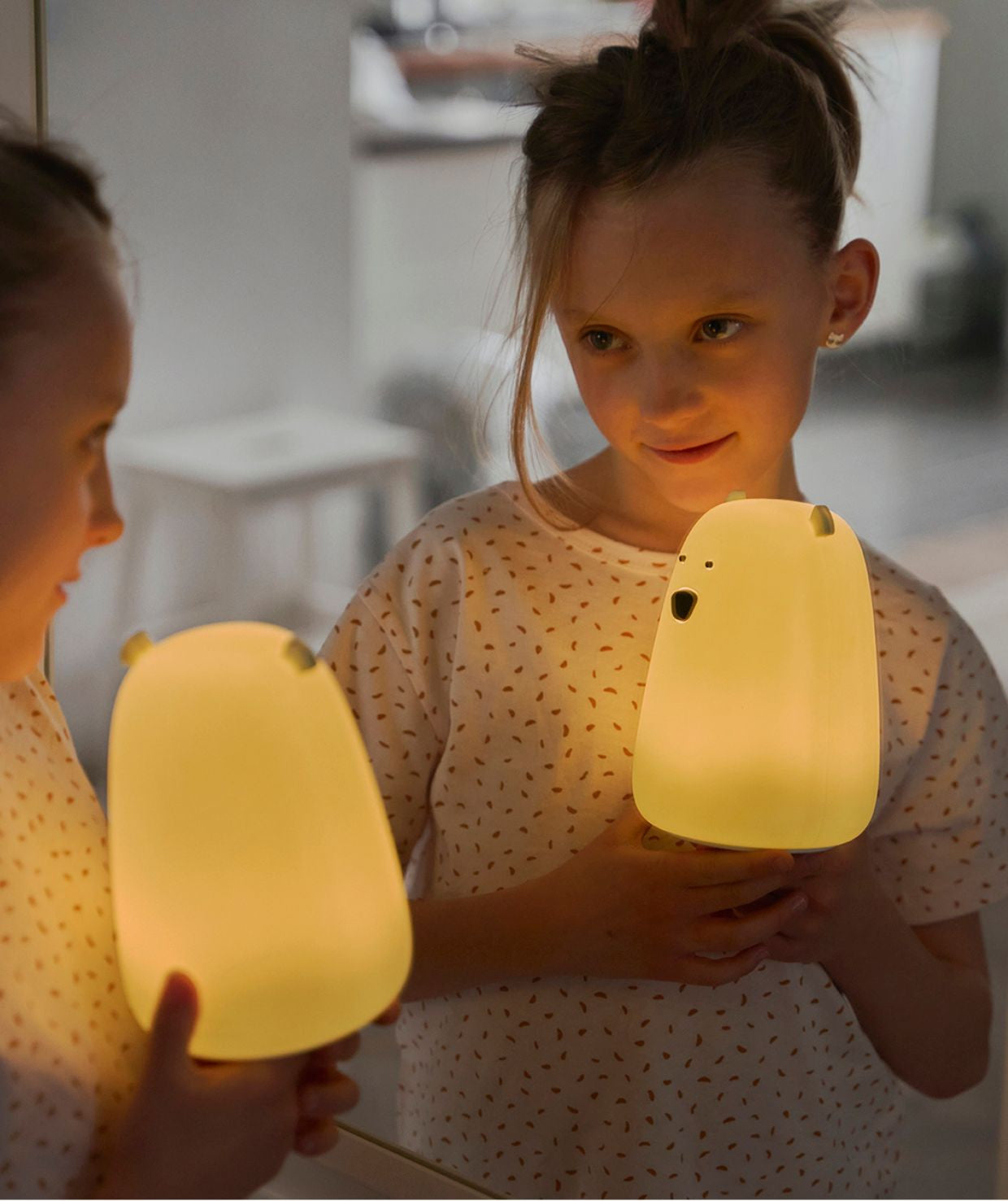 A child-friendly Big Bear silicone lamp by Rabbit & Friends, featuring a teddy bear design with charming details like protruding ears and a round belly. Perfect for bedtime routines and providing a sense of security.