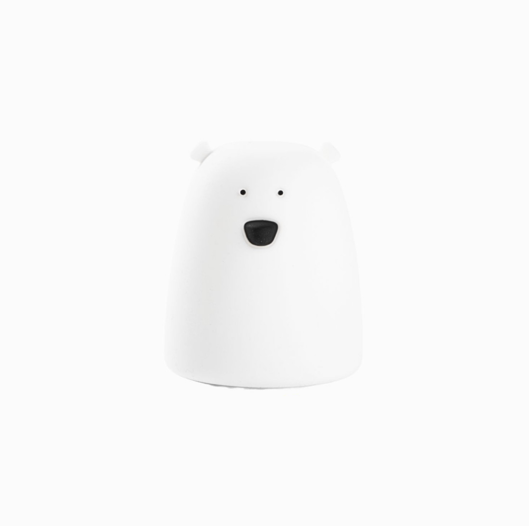 A white bear night light made of soft silicone, tap-operated, shining in 7 colors, battery-powered, and safe for children. Dimensions: 10 x 8.6 x 8.6 cm. Ideal for a comforting glow at night.