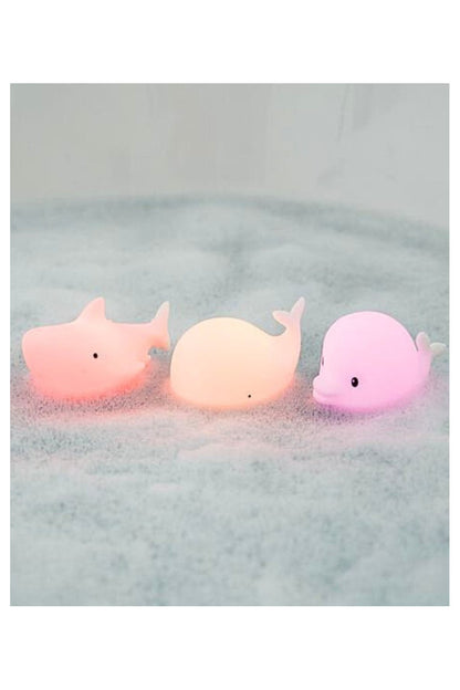 Mini waterproof silicone lamp set featuring dolphin, whale, and shark shapes. Soft, touchable silicone skin, color-changing light, and waterproof design for bath time fun.