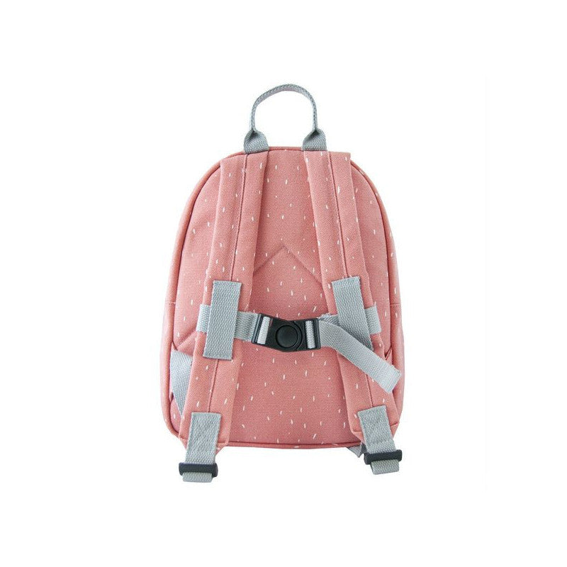 Child's pink backpack with grey straps, white dots, and Mrs Flamingo design. Adjustable padded shoulder straps, chest strap, water-repellent coating, big compartment, front pocket, and name tag inside. Dimensions: 31 x 23 x 10 cm.